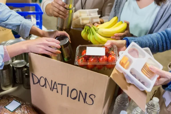 Charitable giving as a family tradition image showing parents and children discussing generosity, values, and long-term legacy goals.